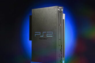 PlayStation 2 console with a selection of game cases, showcasing the iconic design and game library, celebrating its 25th anniversary.